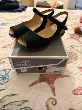 Dansko size 39. Black suede wedge with strap.